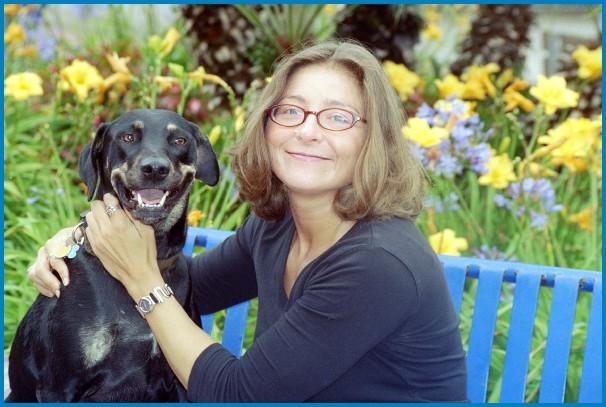 With her canine associate, Ms. Oppenheimer
